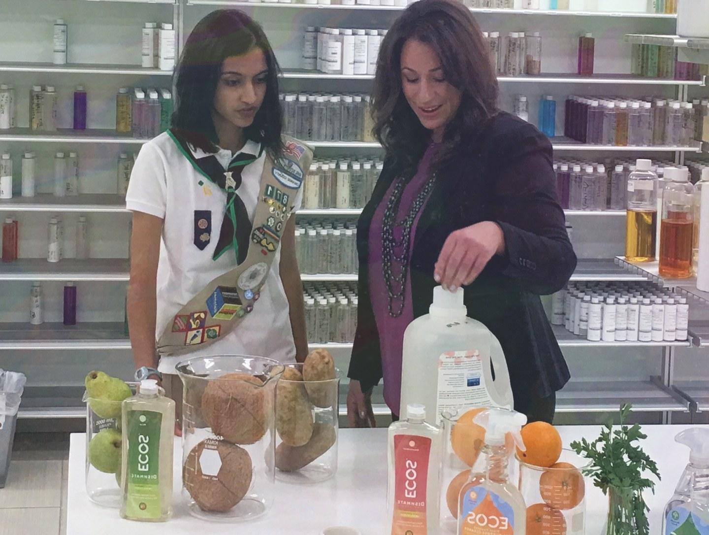 Woman Speaking To Girl About Earth Friendly Products