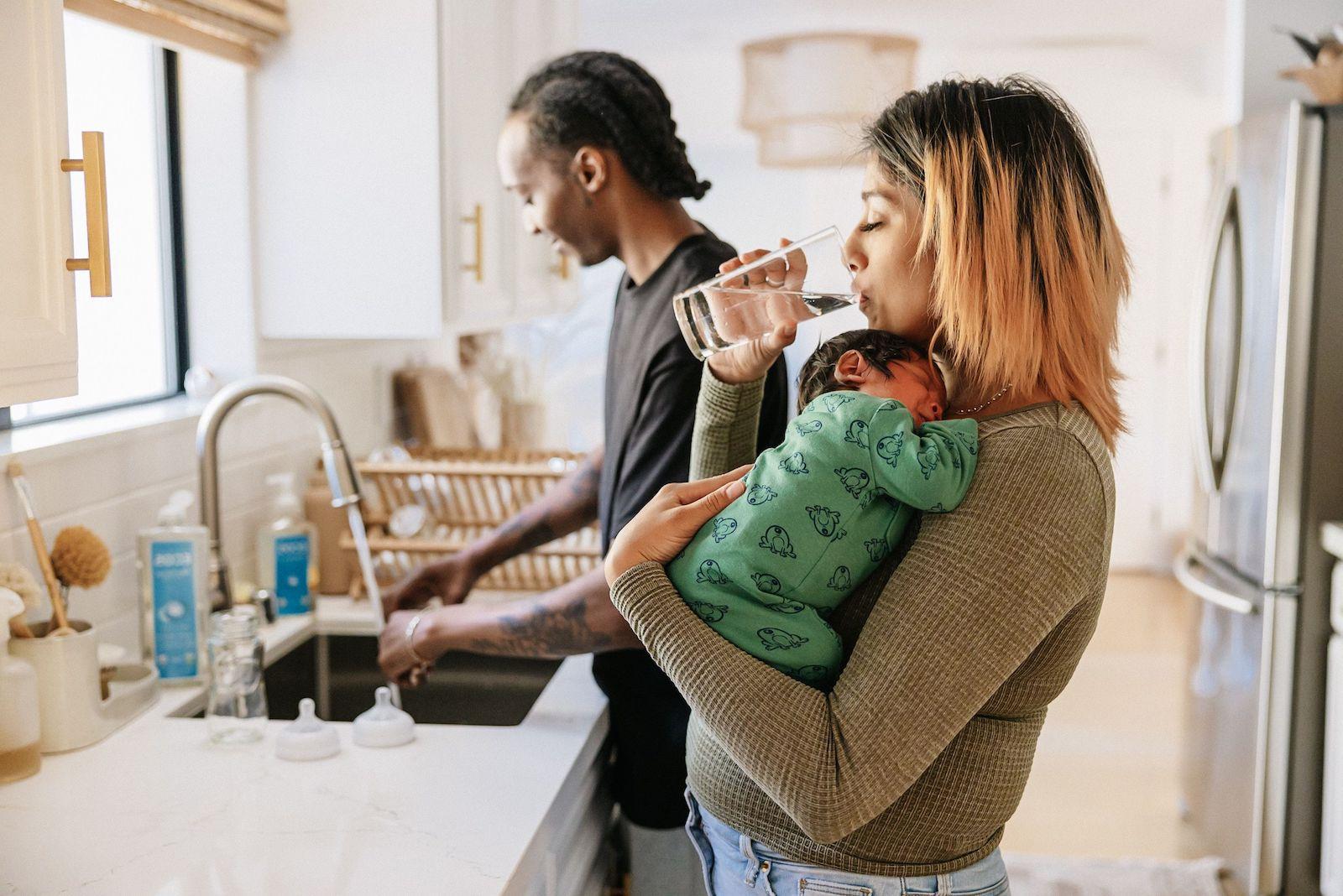 Couple in Kitchen with Newborn