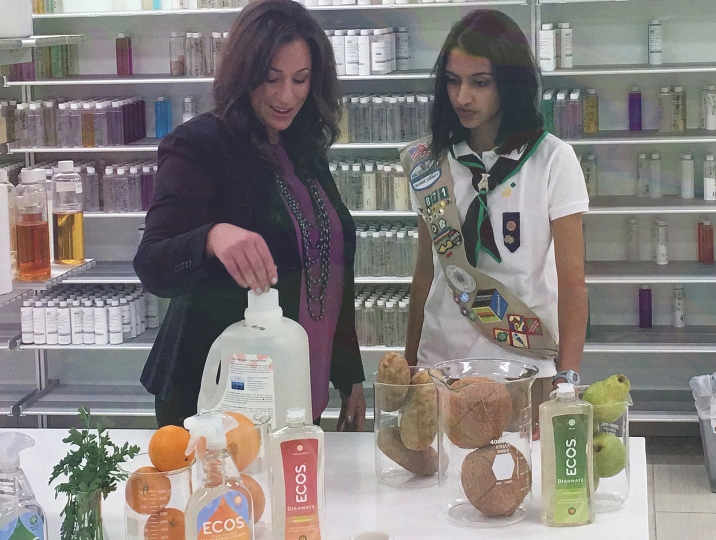Woman Speaking To Girl About Earth Friendly Products