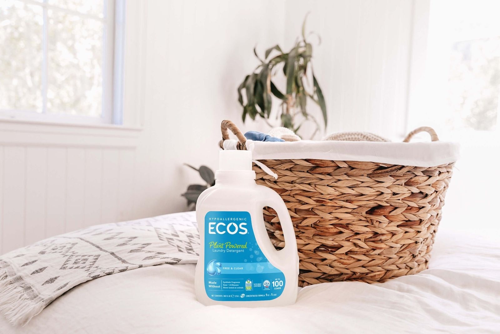 Free & Clear Liquid Detergent on Bed with Laundry Basket