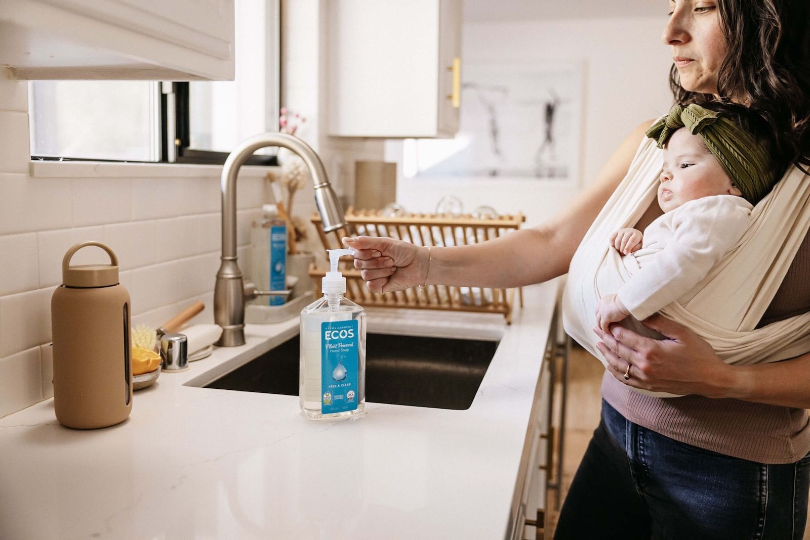 Mother Using Hand Soap With Baby